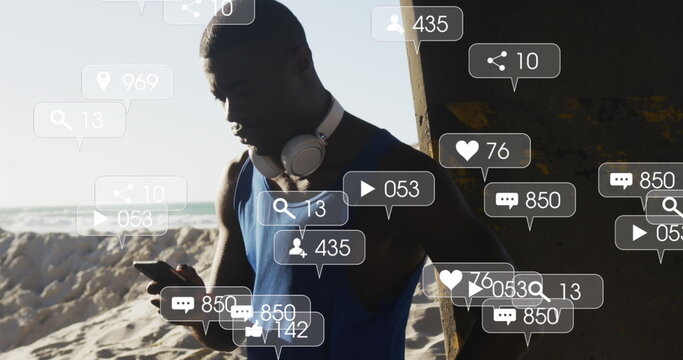 Image of icons over exercising african american man using smartphone