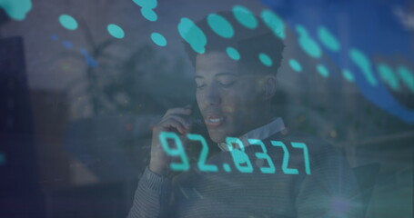 Image of data processing over biracial businessman working in office