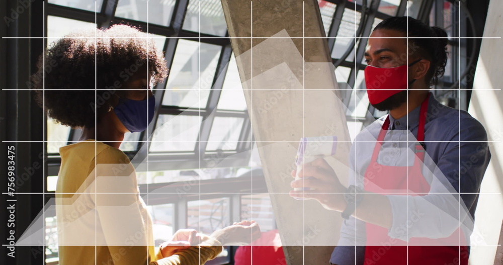 Poster image of digital interface and graph over diverse couple in face masks at work using technology