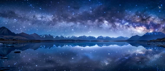Papier Peint photo Réflexion The Milky Way arcs magnificently over a tranquil mountain lake, reflecting a mirror image of the star-studded sky in the still water below.