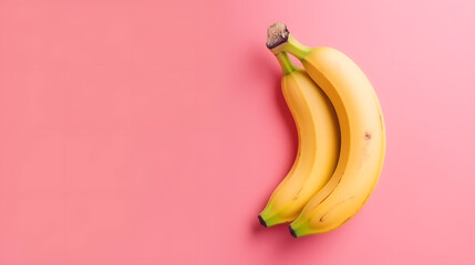 banana on pink background with place for text