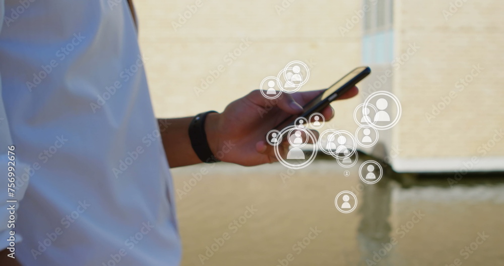 Poster digital composite of walking man showing only his hands while using a mobile phone