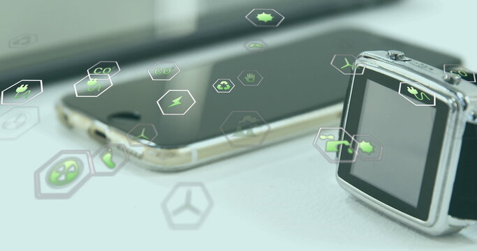 Image of eco icons and data processing over electronic devices