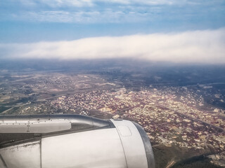 White plane turbine in the atmosphere close-up against the background of a Turkish landscape with a...