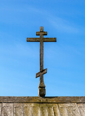 Old wooden cross at the top of a church