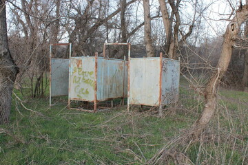 Changing room in the middle of an overgrown beach.