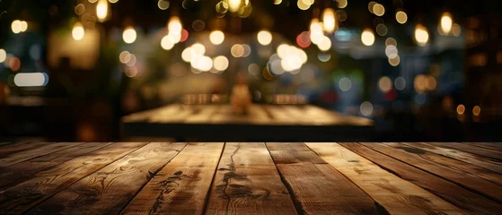 Tuinposter Real wood table with light reflection in dimly lit restaurant pub or bar Ideal for showcasing products in various settings © The Big L