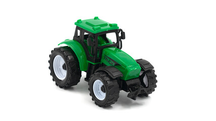 Green toy tractor isolated on white background.