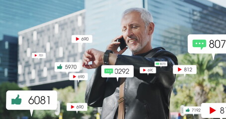 Image of social media icons over senior man using smartphone