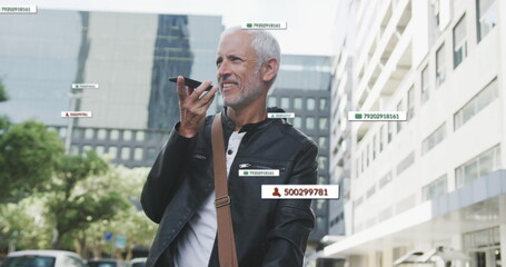 Image of social media icons over senior man using smartphone