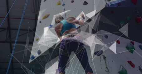 Image of data processing over caucasian woman climbing wall