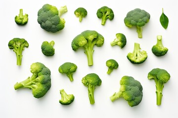 Broccoli-based creative layout. Flat lay. Food concept. Vegetables isolated on white. - obrazy, fototapety, plakaty