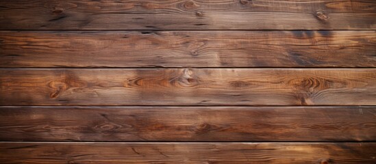 A closeup shot showcasing the intricate pattern of the brown hardwood planks on the wall, with a blurred background adding depth to the image