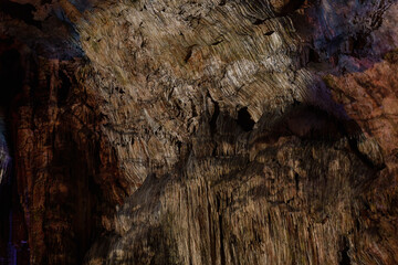 rocks from a cave with projected images
