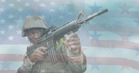 Image of soldier with gun over american flag