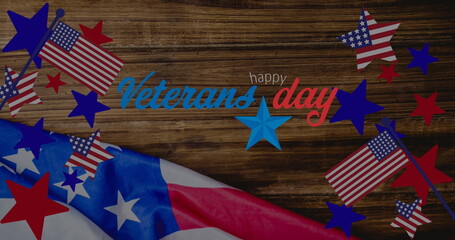 Image of veterans day text over wooden table and american flag