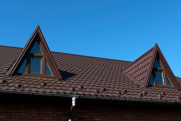 Part of house roof against sky © PumpedVisuals