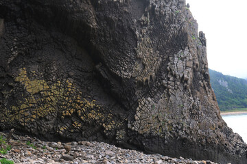 texture of porous stones on the beach, nature, natural phenomena, grey stones, columnar stones,...