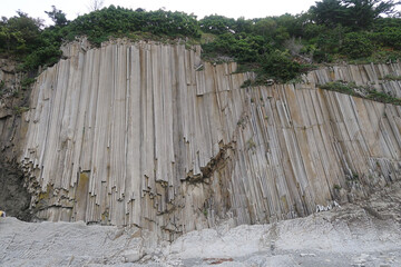 texture of porous stones on the beach, nature, natural phenomena, grey stones, columnar stones,...