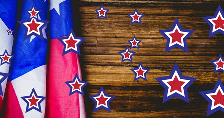 Fototapeta premium Image of stars coloured in american flag over wooden background