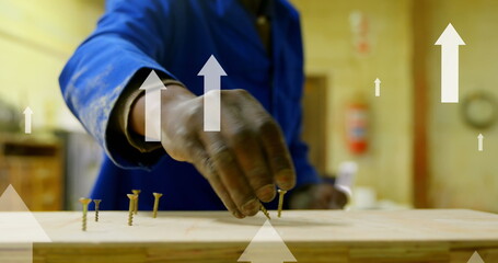 Image of arrows over male african american worker in warehouse