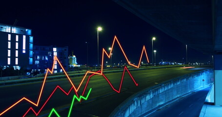 Image of lines and financial data processing over cityscape at night
