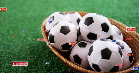 Image of social media icons on banners over footballs in basket