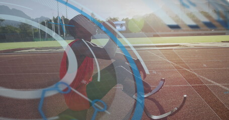 Image of digital data processing over disabled male athlete with running blades on running track
