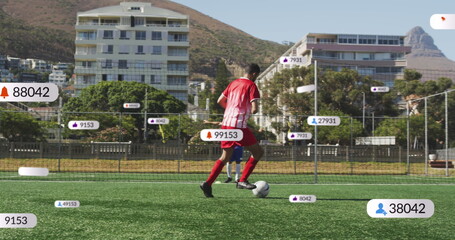 Image of social media icons on banners over football match