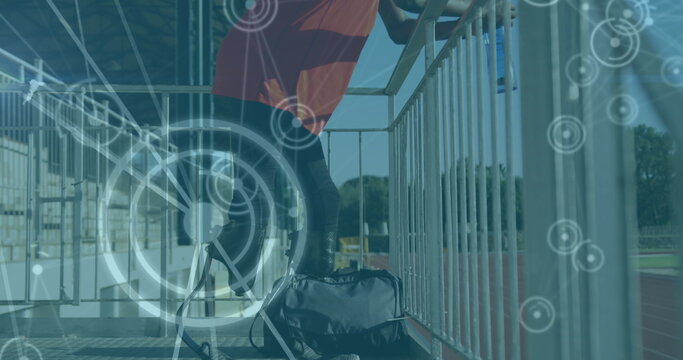 Image of digital data processing over disabled male athlete with running blades drinking water