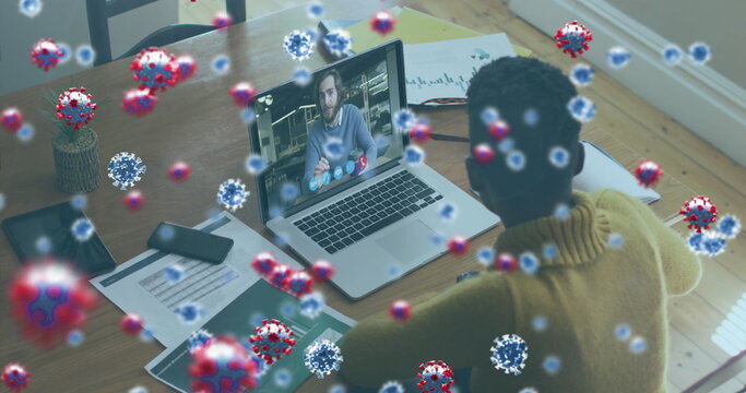 Image of covid 19 cells over businesswoman on laptop image call - Powered by Adobe