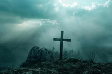Moody atmosphere with a solitary cross on a hill in misty conditions, signifying solitude and contemplation. - obrazy, fototapety, plakaty
