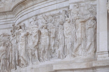 Vittoriano War Memorial Relief Detail Depicting People, Cows an a Horse in Rome, Italy
