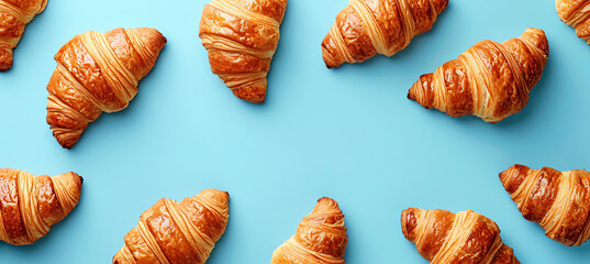 banner of croissants on the blue background