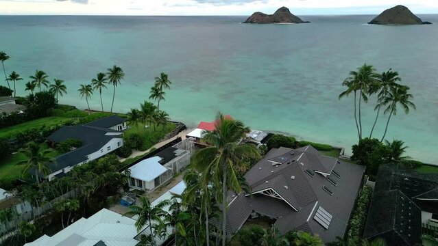 Oceanside Houses At Lanikai Beach In Kailua, Oahu, Hawaii. aerial ascending shot