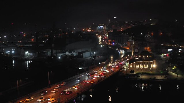 Flying above highway bridge in Istanbul between Beyoglu and Eminönü districts at night