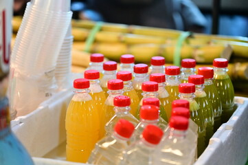 In Taiwan's Ningxia Night Market, juice stalls offer freshly squeezed orange and sugarcane juice. Bundles of white sugarcane are displayed on the stalls, waiting to be juiced into refreshing beverages