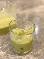 matcha in glass on the table