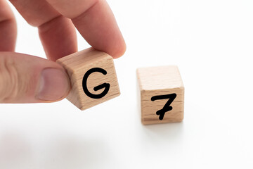 Human hand put wooden block and set technology word G7. Network future. High speed of mobile...