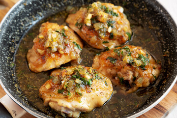 Homemade Garlic Brown Sugar Chicken in a Pan, side view.