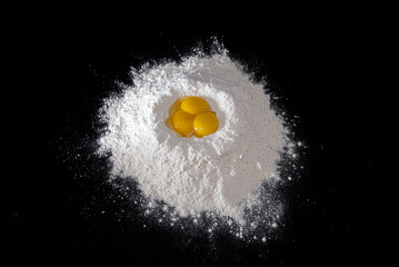 Egg yolks in flour - obrazy, fototapety, plakaty