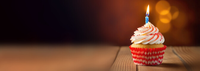 Birthday greeting concept. candle on a cupcake. - obrazy, fototapety, plakaty