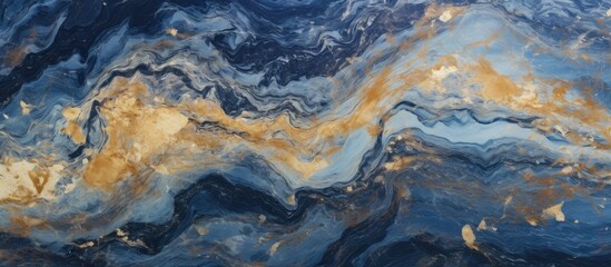 Closeup of a mesmerizing blue and gold marble texture resembling a water wave in a natural landscape. The pattern is reminiscent of electric blue art in the city