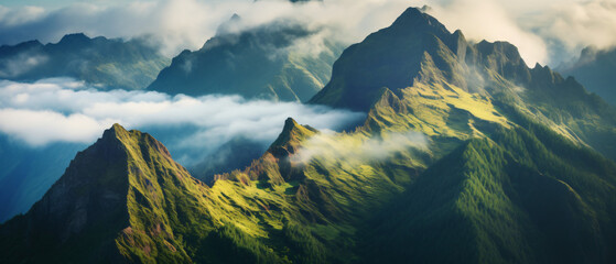 Foggy Madeira mountains with peaks in the clouds 