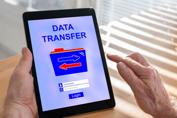 Data transfer concept on a tablet - obrazy, fototapety, plakaty