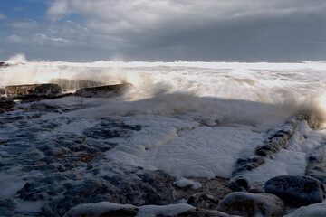 Seascape with waves and rocks.