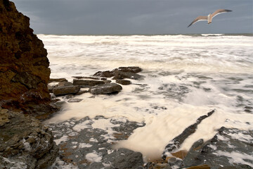 Seascape with waves and rocks.
