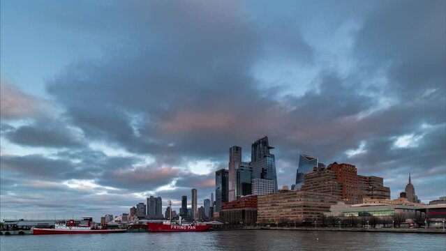 Day to night time lapse of sunset over Hudson Yards and Midtown Manhattan at Hudson Riverside