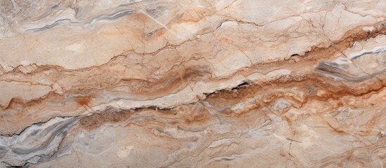Obraz premium A detailed closeup view of a beige marble texture with swirling patterns resembling wood grain. This natural material can be used for flooring or countertops in a variety of cuisine settings