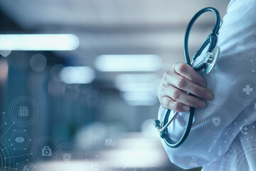 Doctor in uniform on blurred hospital background.